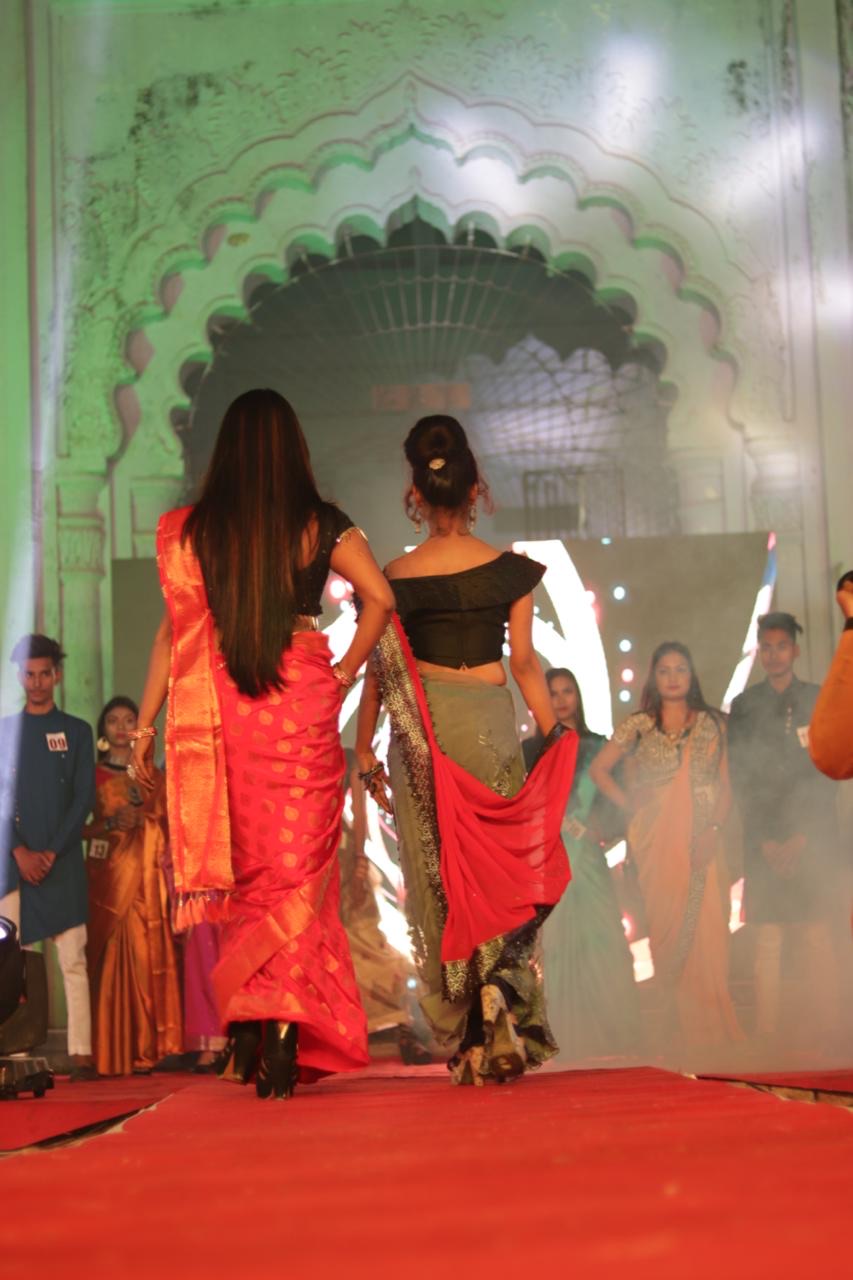 Fashion model striking a confident pose during runway show